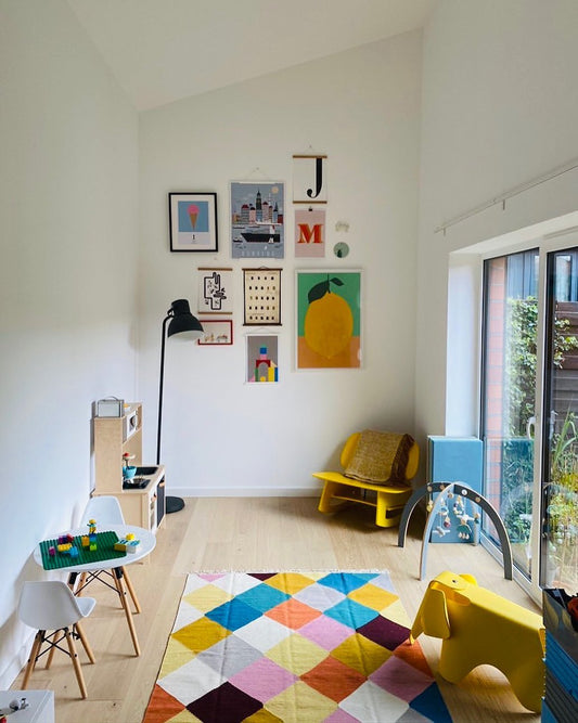 Lemon With Two Leaves and Bauhaus Tower art prints in a kids room